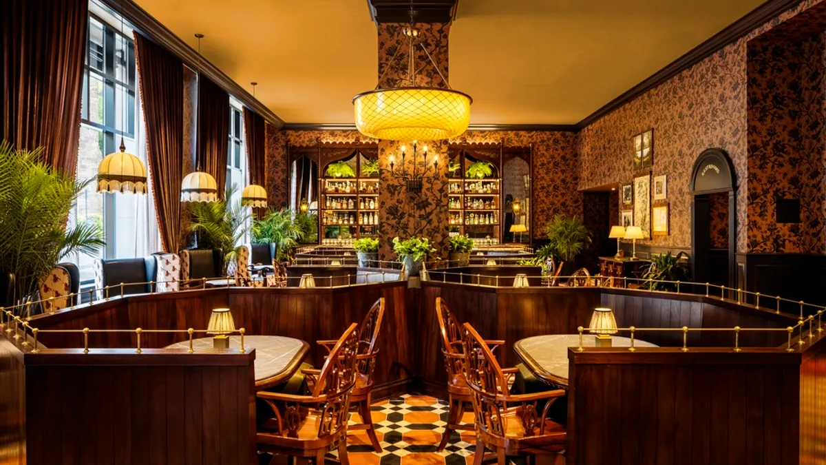 The interior of a restaurant features tiled floors and wood accents.