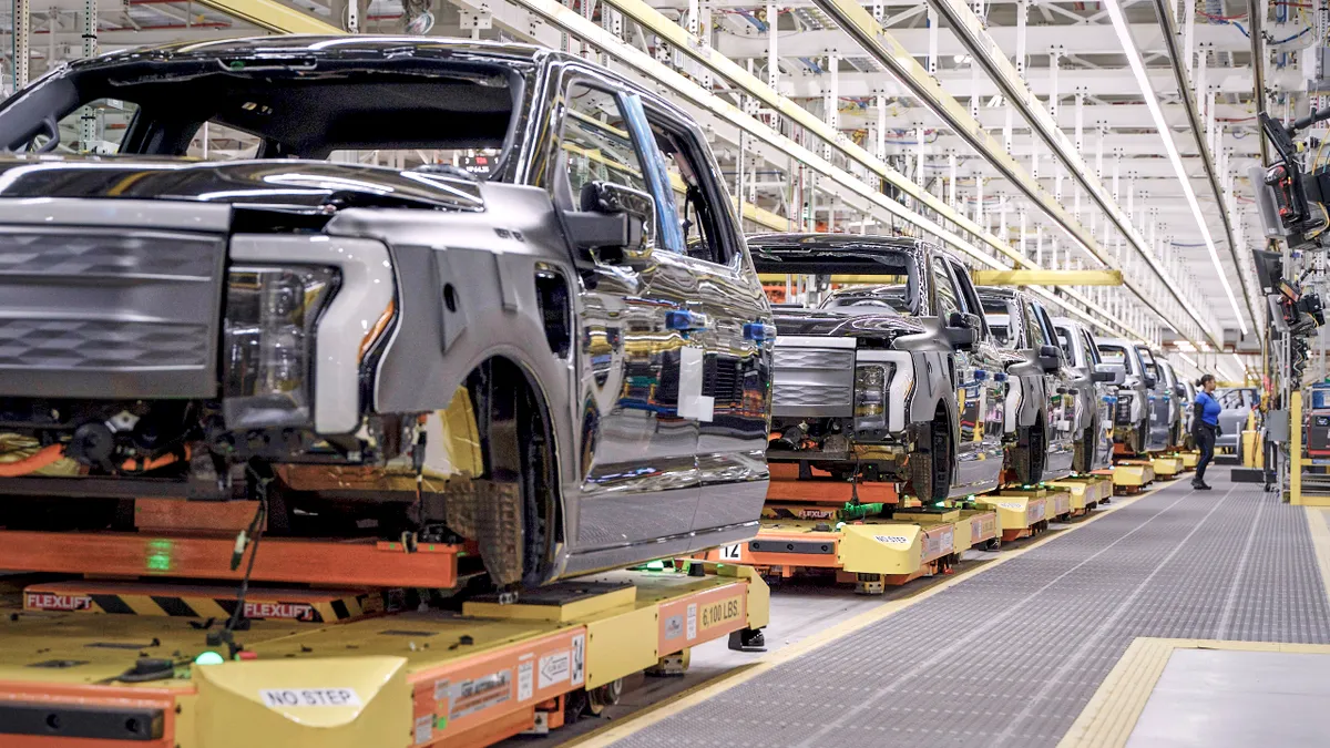 F-150 Lightning pickups on the assembly line at Ford's Rouge Electric Vehicle Center in Michigan.