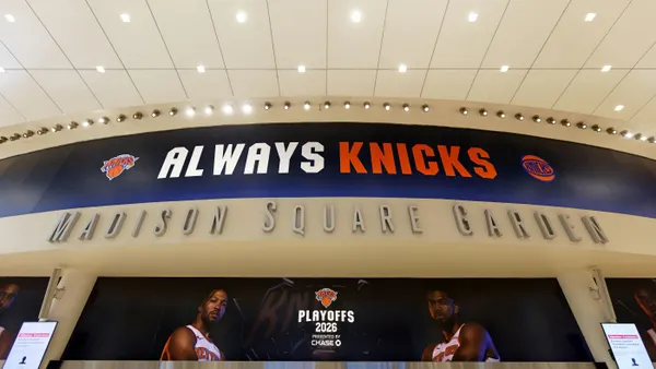 an always knicks sign displayed with photos of players at madison square garden in new york city