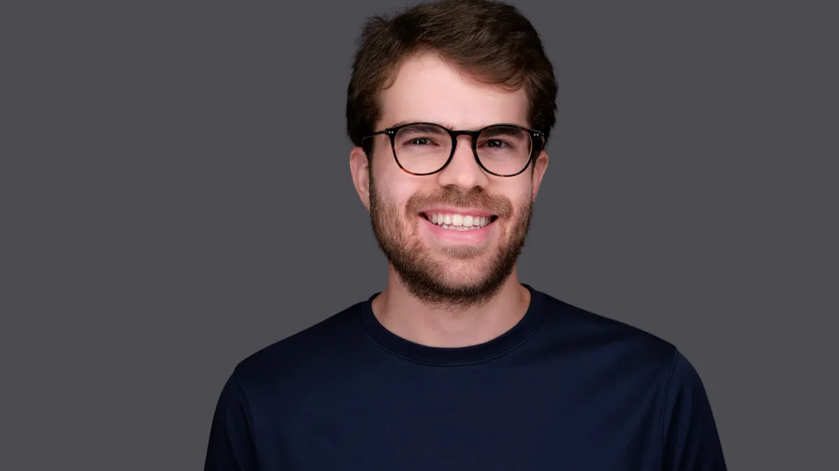 Brex CEO Pedro Franceschi pictured against a grey background.