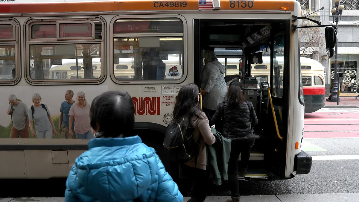 Passengers board a MUNI bus in San Francisco, California.