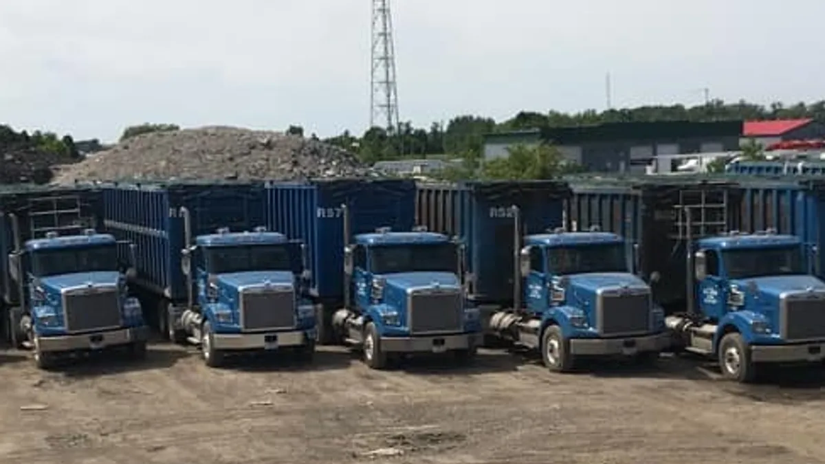 MJ Lavoie trucks in a gravel lot.