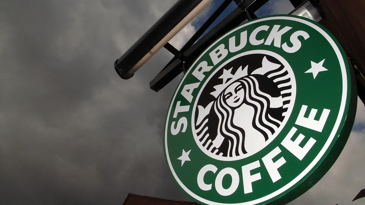 The Starbucks logo hangs outside one of the company's cafes in Northwich on 3 July, 2008 in Northwich, England.