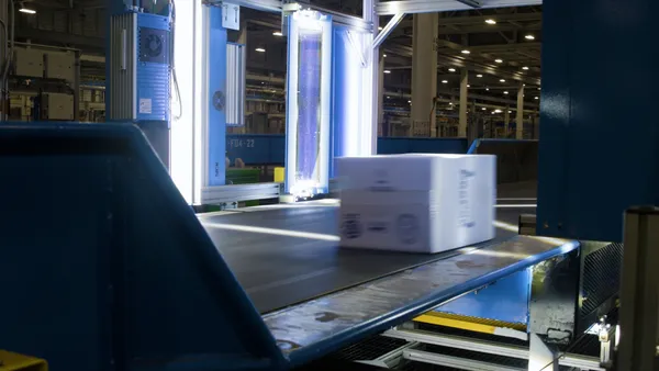 A package moves through a six-sided scanning tunnel at FedEx's Secondary 25 facility in Memphis, Tennessee.