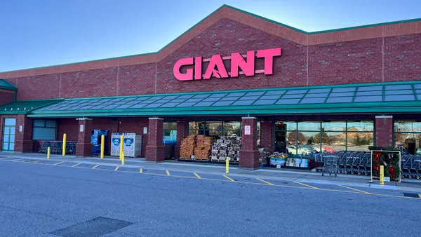 a brick and mortar supermarket store with Giant brand signage in red letters