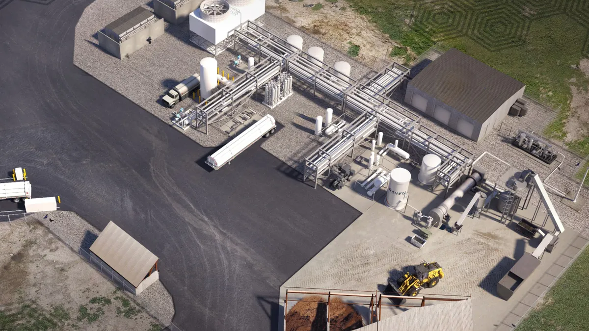 Aerial rendering of an industrial facility with construction equipment and a shed for biomass.