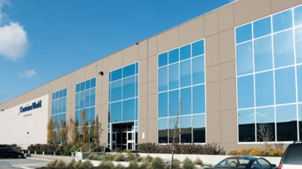 An exterior photograph of the headquarters of ContainerWorld Forwarding Services.