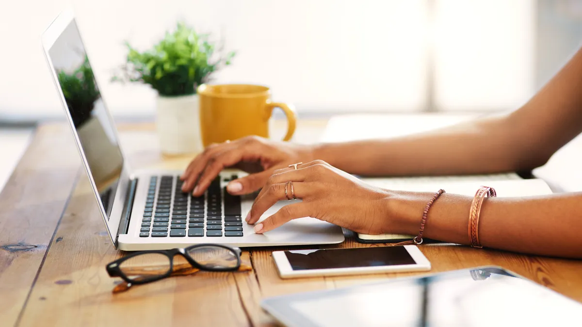 A woman typing.