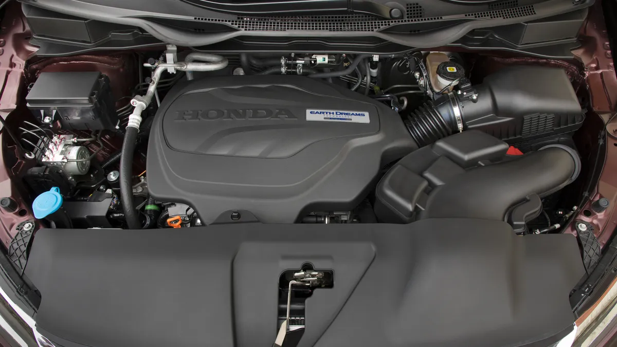 The engine bay of a 2018 Honda Odyssey equipped with the automaker's 3.5 liter six-cylinder engine.