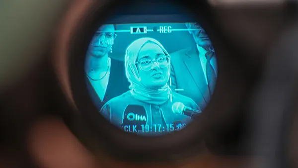 Rumeysa Ozturk seen through a video camera.