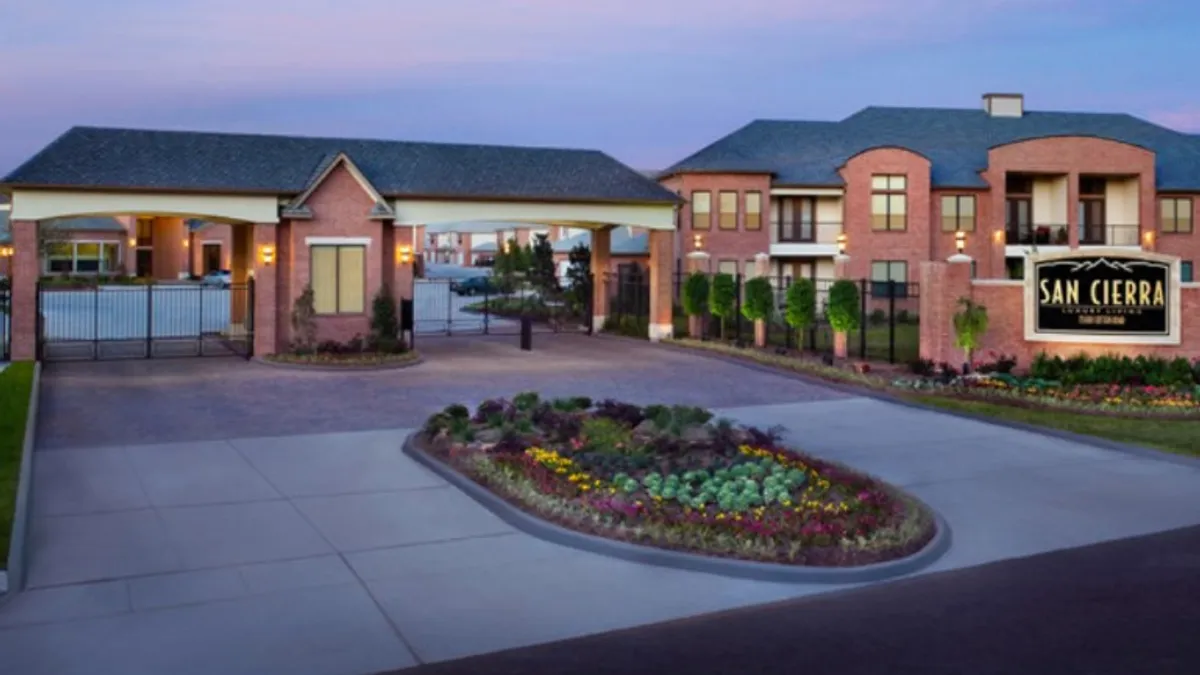 Brick garden-style apartments and  pool.