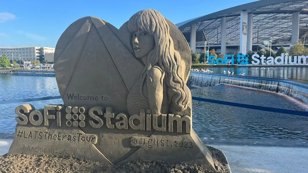 A sand sculpture features Taylor Swift's likeness outside of SoFi Stadium in Los Angeles.