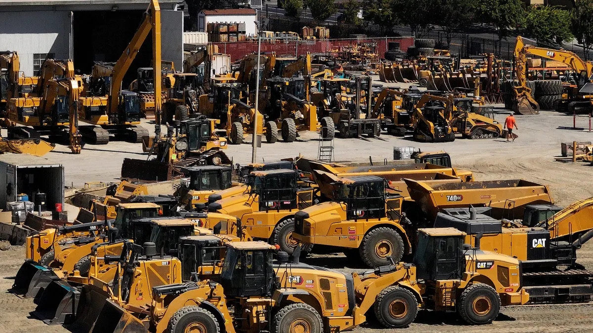 Caterpillar equipment sits in a lot