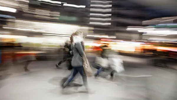 fuzzy photo of a person sitting in the middle of the street