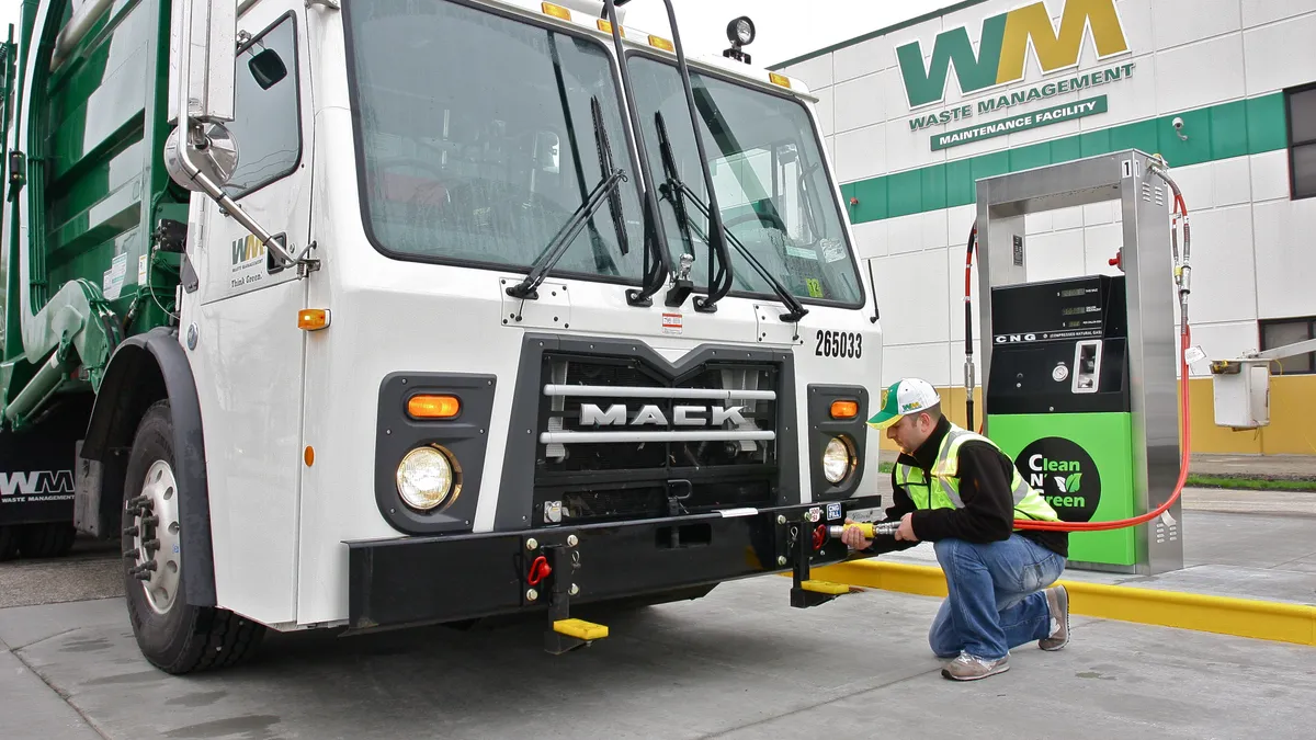 Waste Management truck being fueled