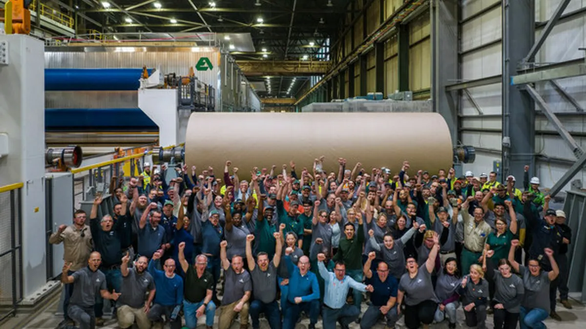 Workers celebrate at Cascades Containerboard Packaging plant in Bear Island, Virginia