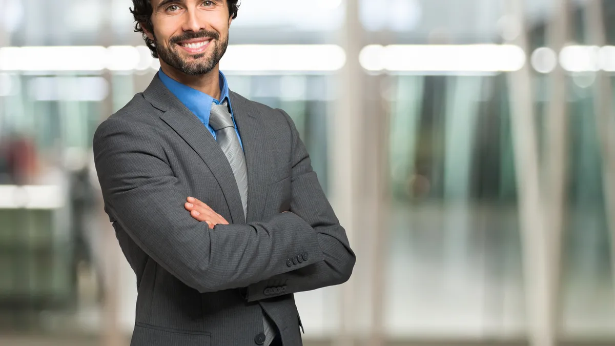 A lawyer in a business suit standing in their office