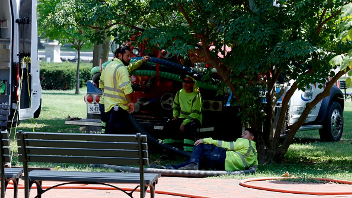 workers rest in the shade