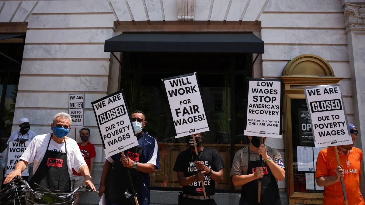 Activists with One Fair Wage participate in a “Wage Strike" demonstration outside of the Old Ebbitt Grill restaurant on May 26th, 2021 in Washington, DC.