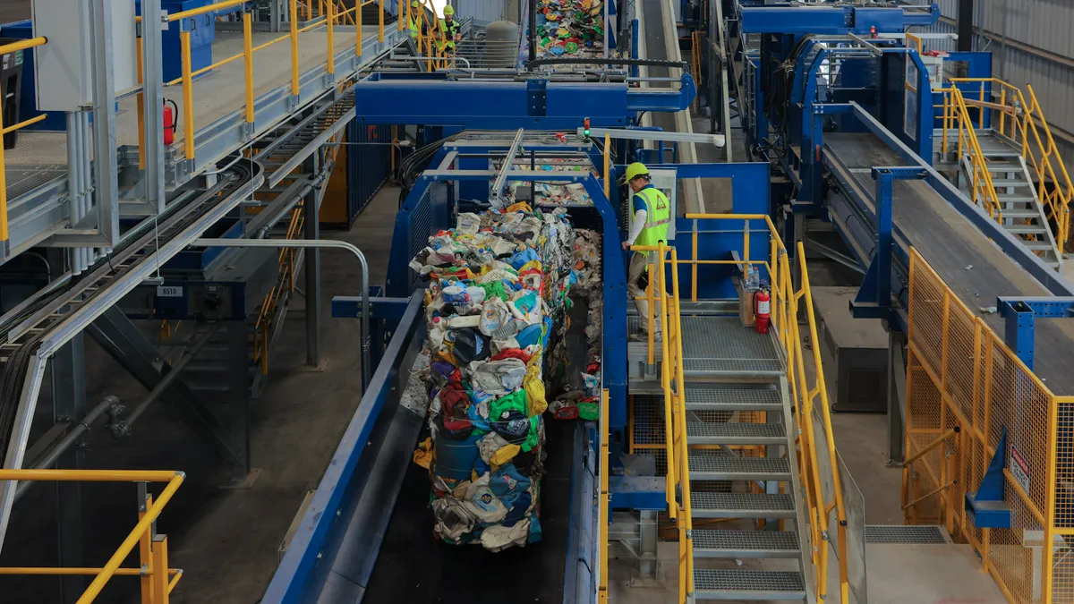 Bales of plastic go down a conveyor belt at Republic's Las Vegas Polymer Center