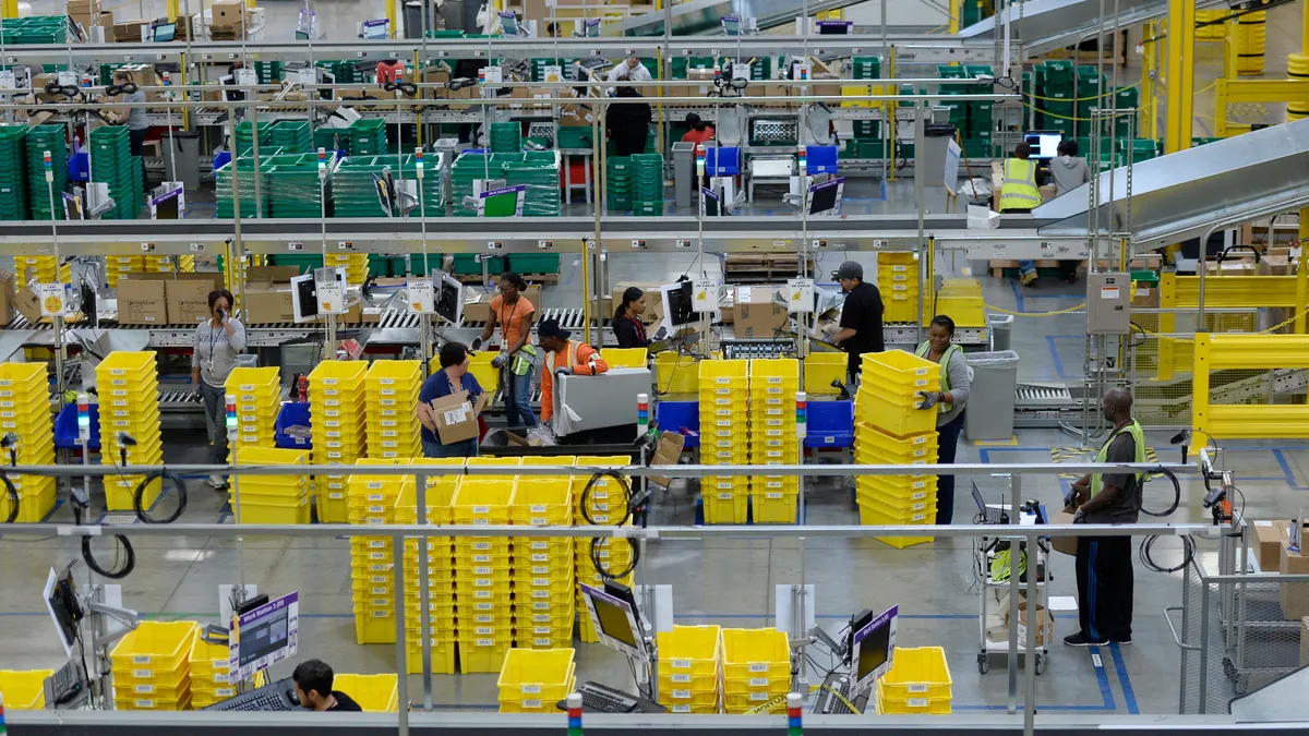 Employees prepare orders at Amazon's San Bernardino Fulfillment Center on October 29, 2013 in San Bernardino, California.