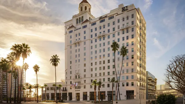 The exterior of a white hotel building.