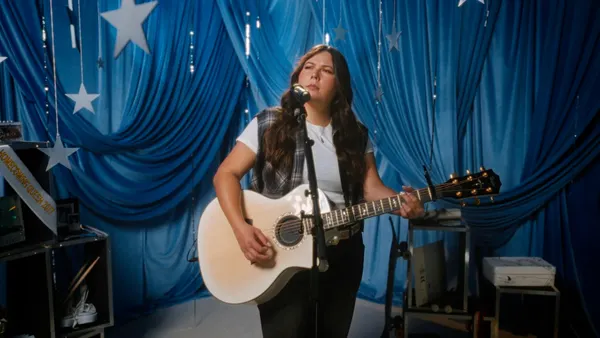 Gigi Perez plays guitar in a Hollister video