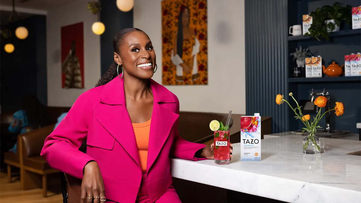 Issa Rae in a cafe as part of a Tazo campaign