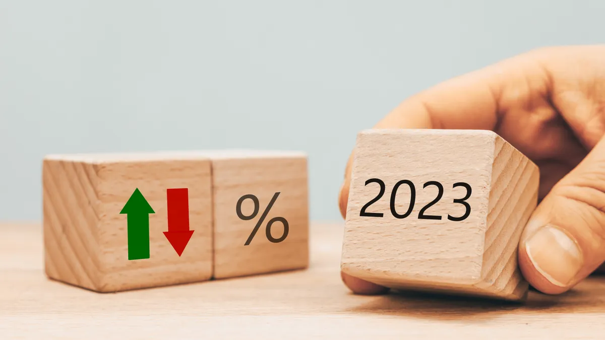 Blocks show year of 2023 and interest rate sign.