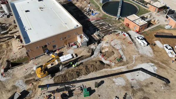 A construction site with detritus and other materials laying about.