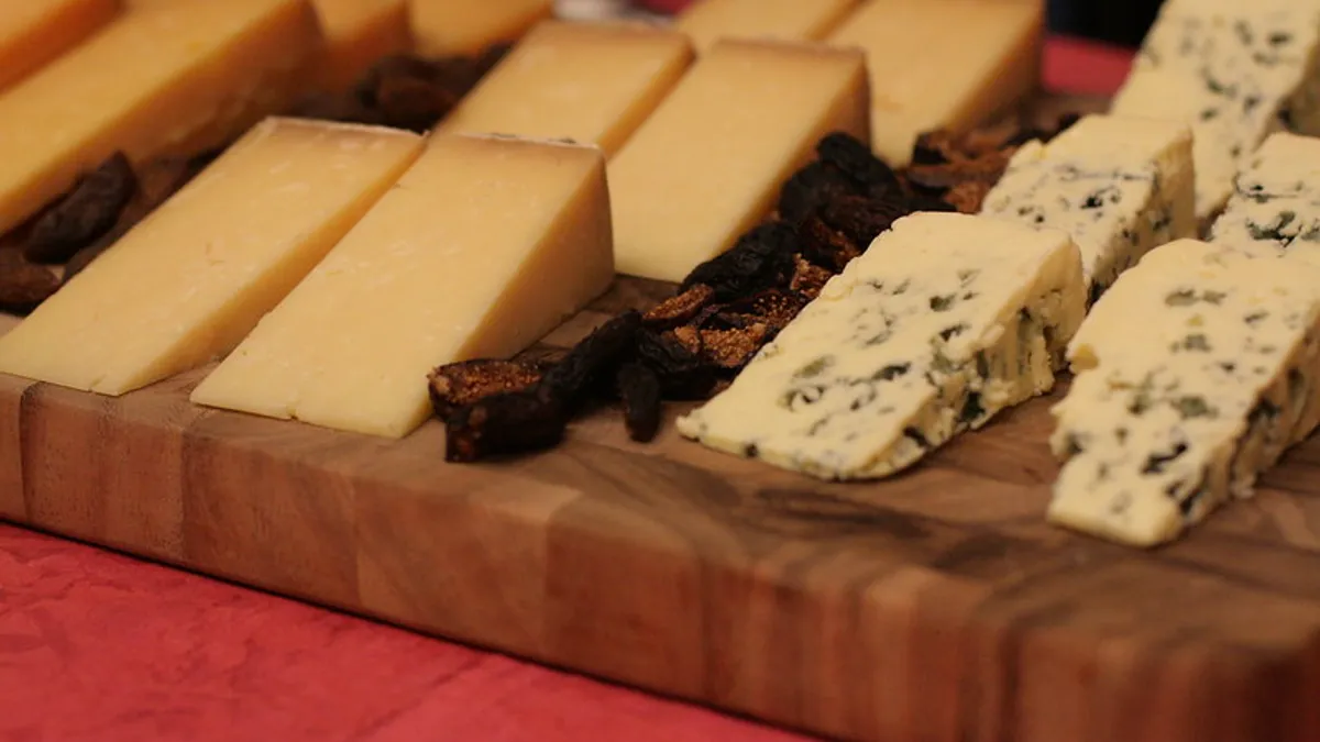 Various cheese varieties on a board