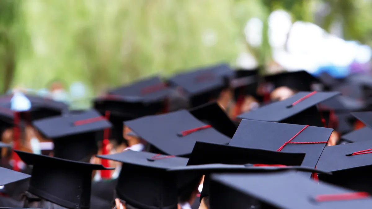 Graduates receive a certificate at the university