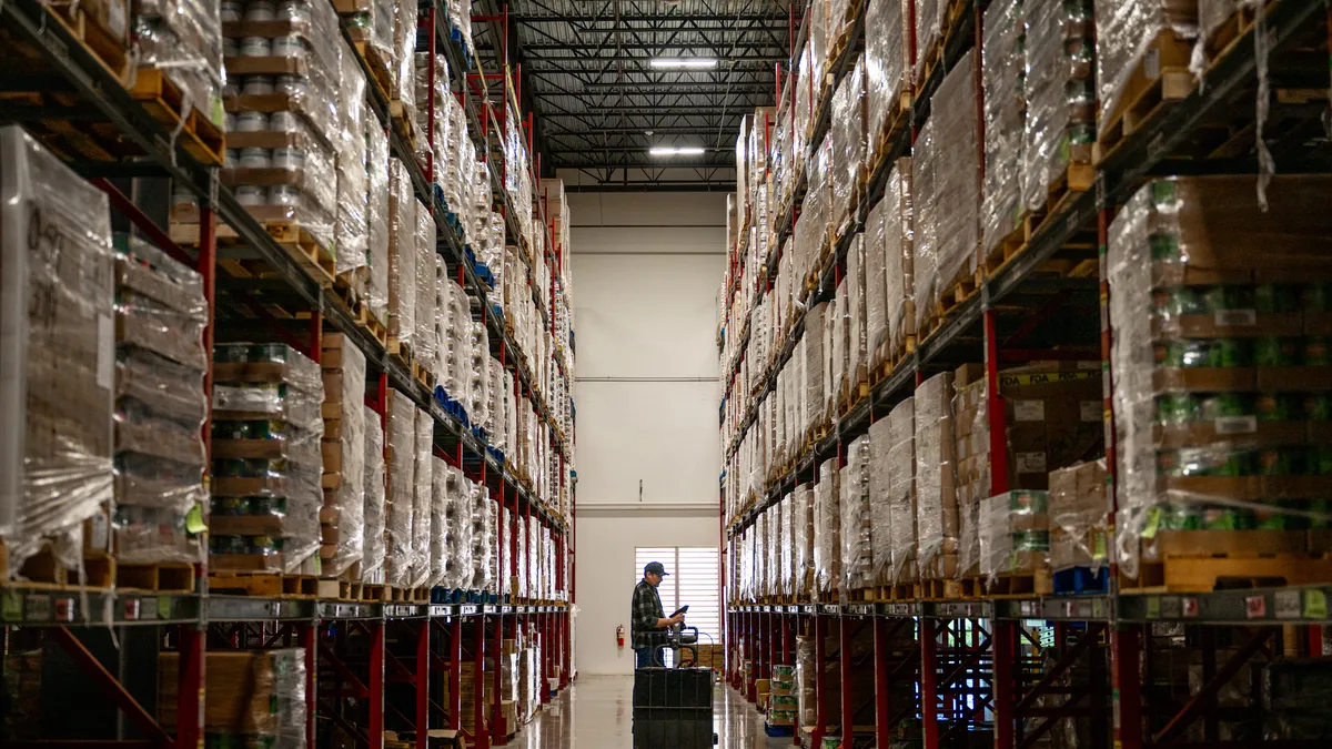 An employee checks through inventory at the Central Texas Food Bank.