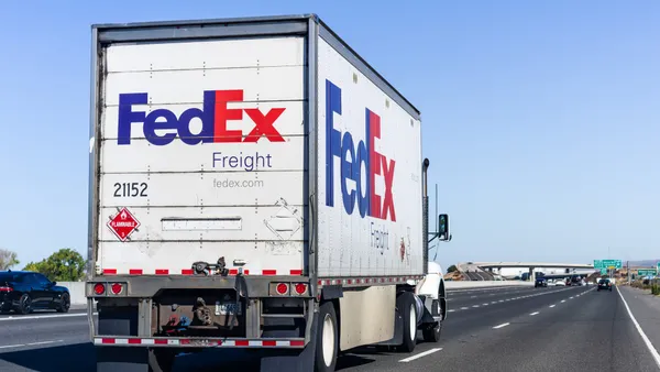 A FedEx Freight tractor-trailer drives on the road. The industry will be closely watching the LTL carrier's spinoff in the next 18 months.