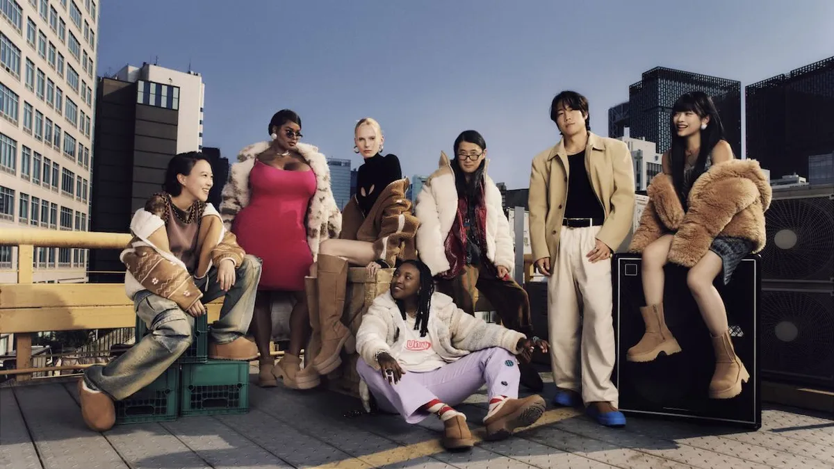 A diverse group of people hanging out on a city rooftop.