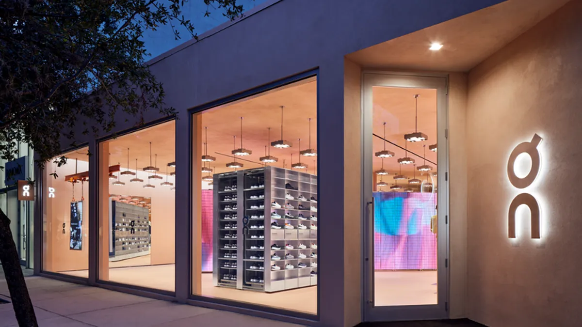 Warmly lit exterior image of On's Miami store