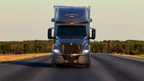 An International truck faces a camera head on.