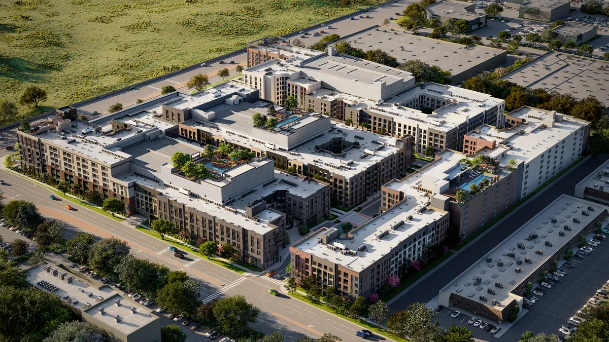 An overhead view of a set of buildings arranged in a square.