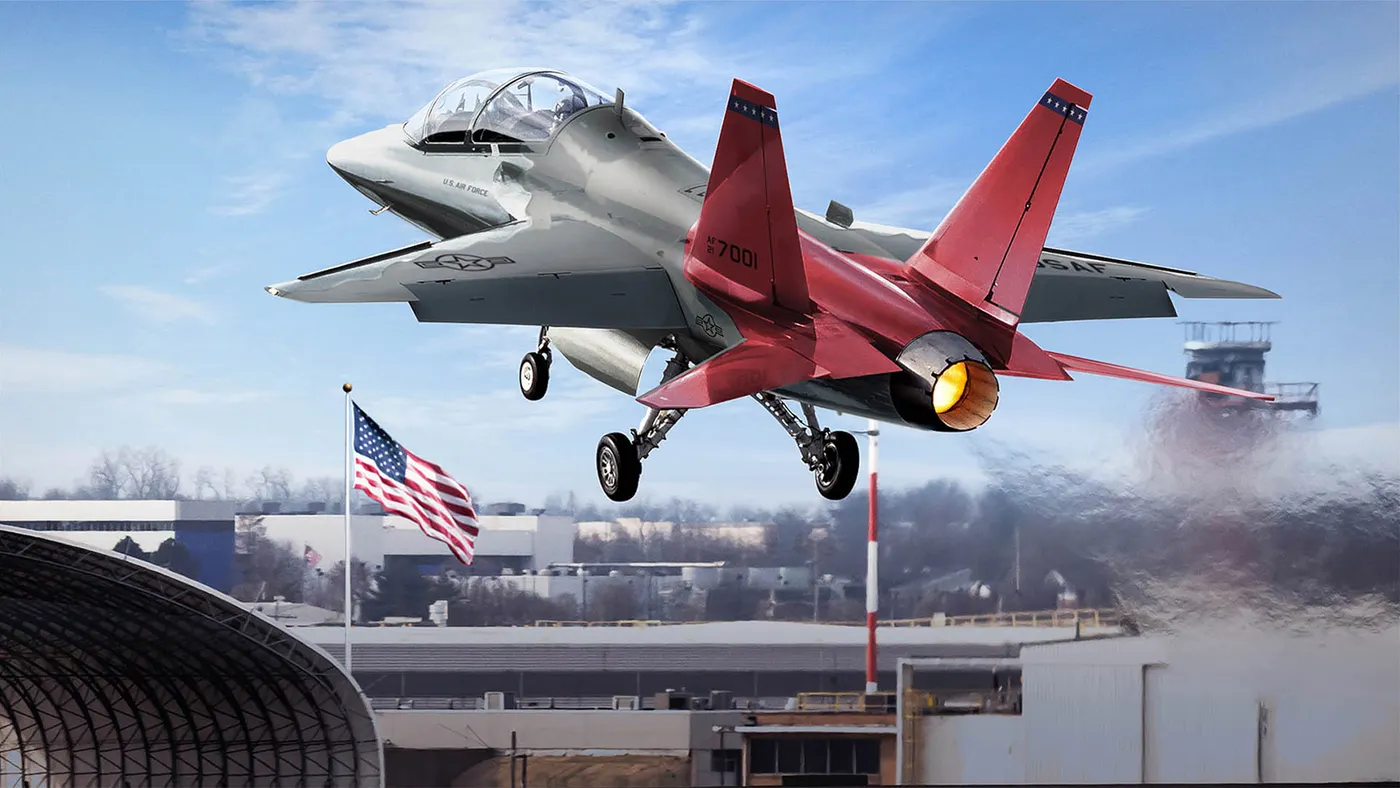 A gray fighter jet with a red tail taking off from the runway and into the sky.
