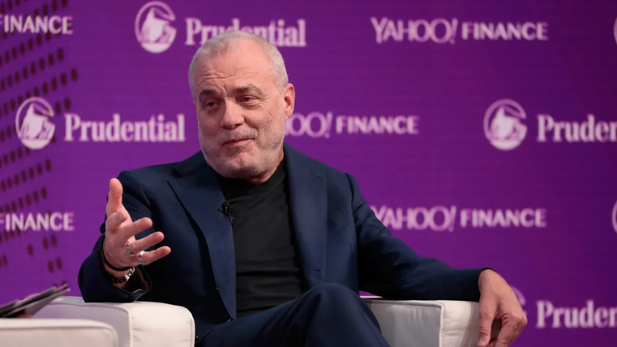 Mark Bertolini onstage at a conference