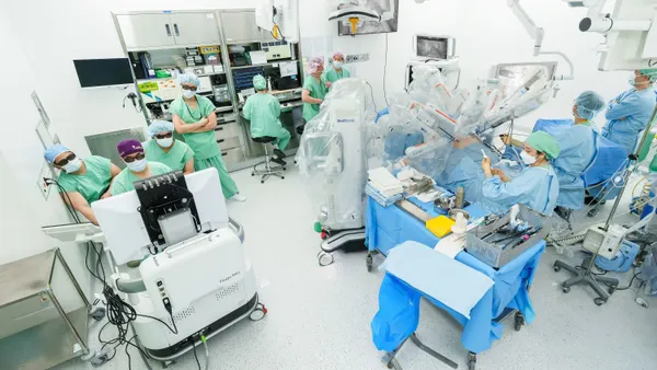 Medtronic's Hugo robotic surgery system is shown in an operating room in Seoul, South Korea, with a surgical team.