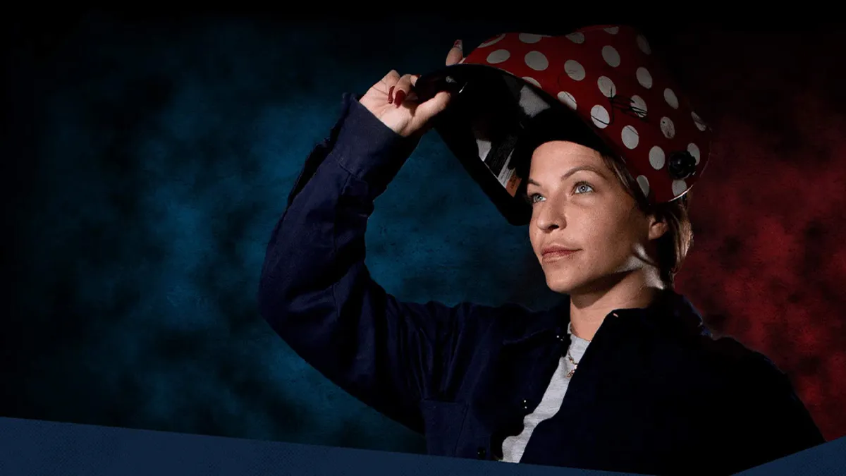 Woman lifting up safety helmet/mask off face and looking ahead