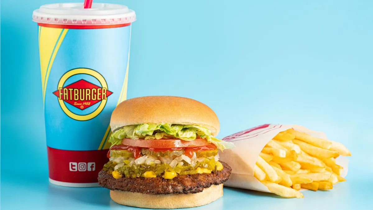 A photograph of a burger, drink and fries from Fatburger.