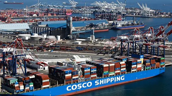 A container vessel sits docked at an ocean port located in Long Beach, California.