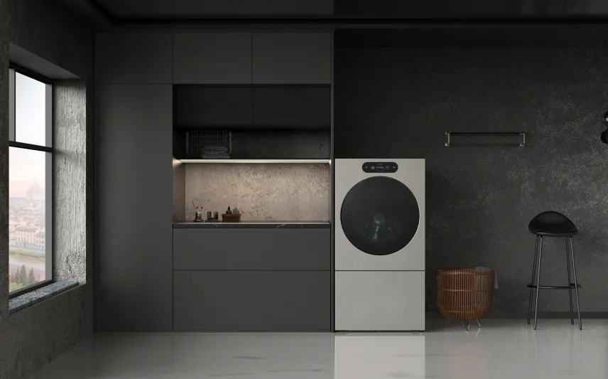 A black-walled laundry room with a washer-dryer in it.