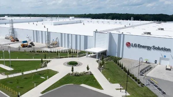 An exterior view of the LG Energy Solution battery manufacturing plant in Lansing, Michigan showing the company's corporate logo.