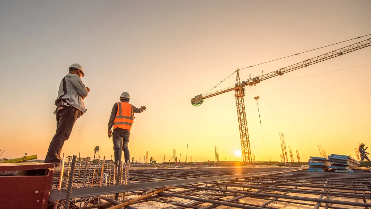 Silhouette group of worker and civil engineer in safety uniform install reinforced steel