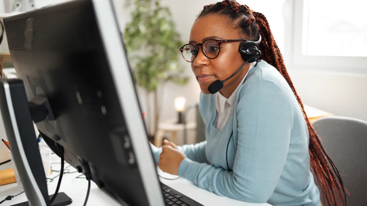 Shot of a young female call center agent.