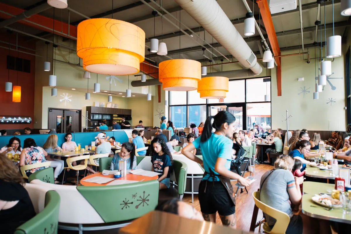 A photograph of the inside of a Snooze A.M. Eatery cafe.