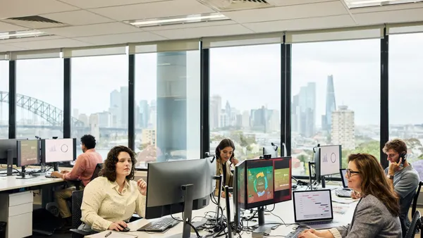 Business professionals working on computers